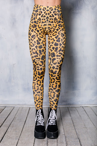 leopard print leggings on a woman wearing black platform boots