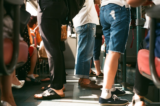 people standing while travelling in a high physical excersize