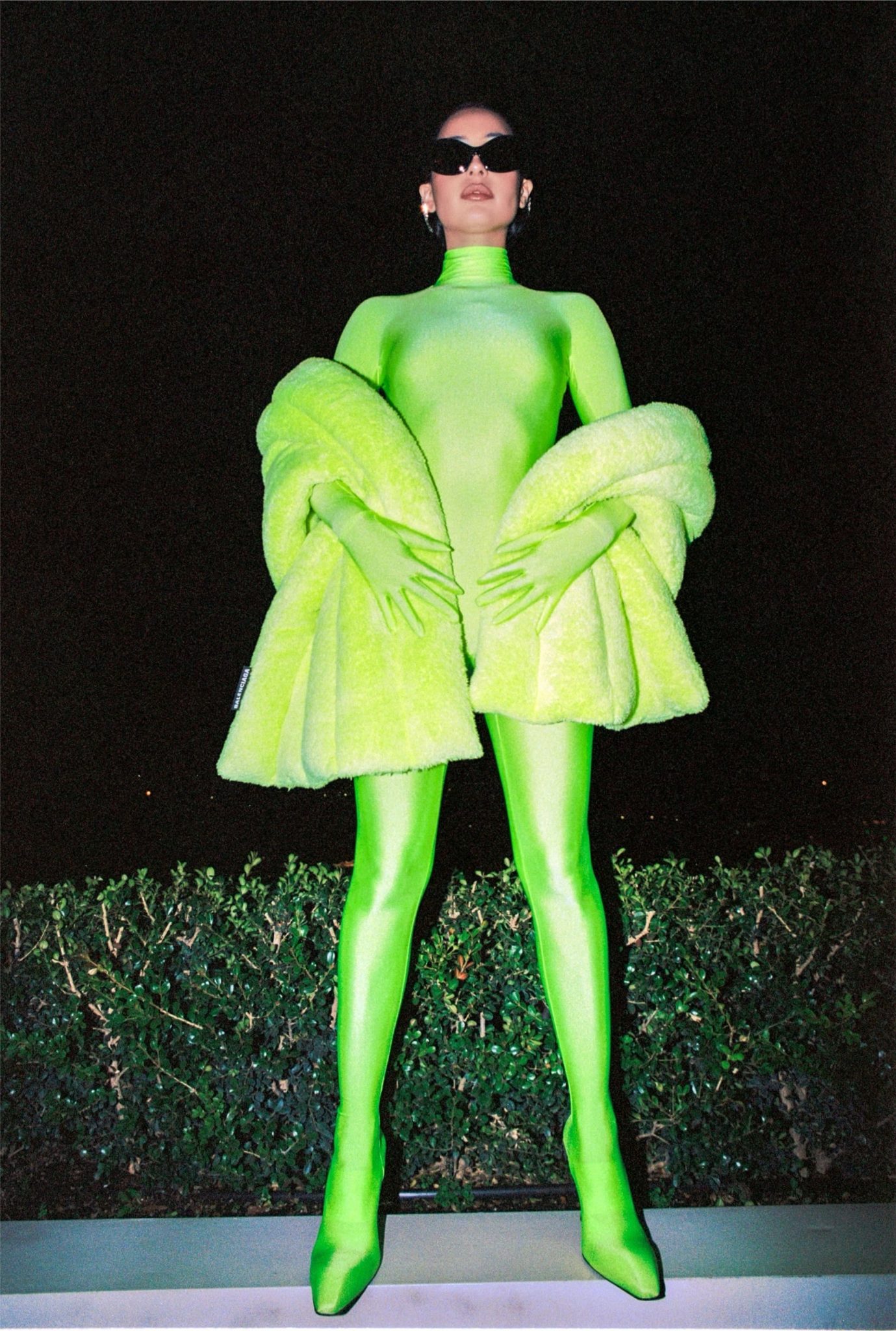 Alexa Demie wearing a green ensemble