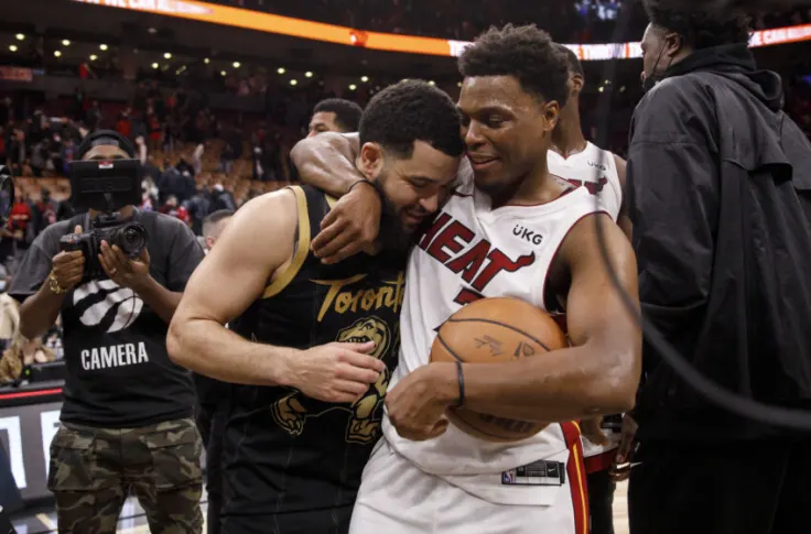 Kyle Lowry and his former teammate Fred Vanvleet share a moment.