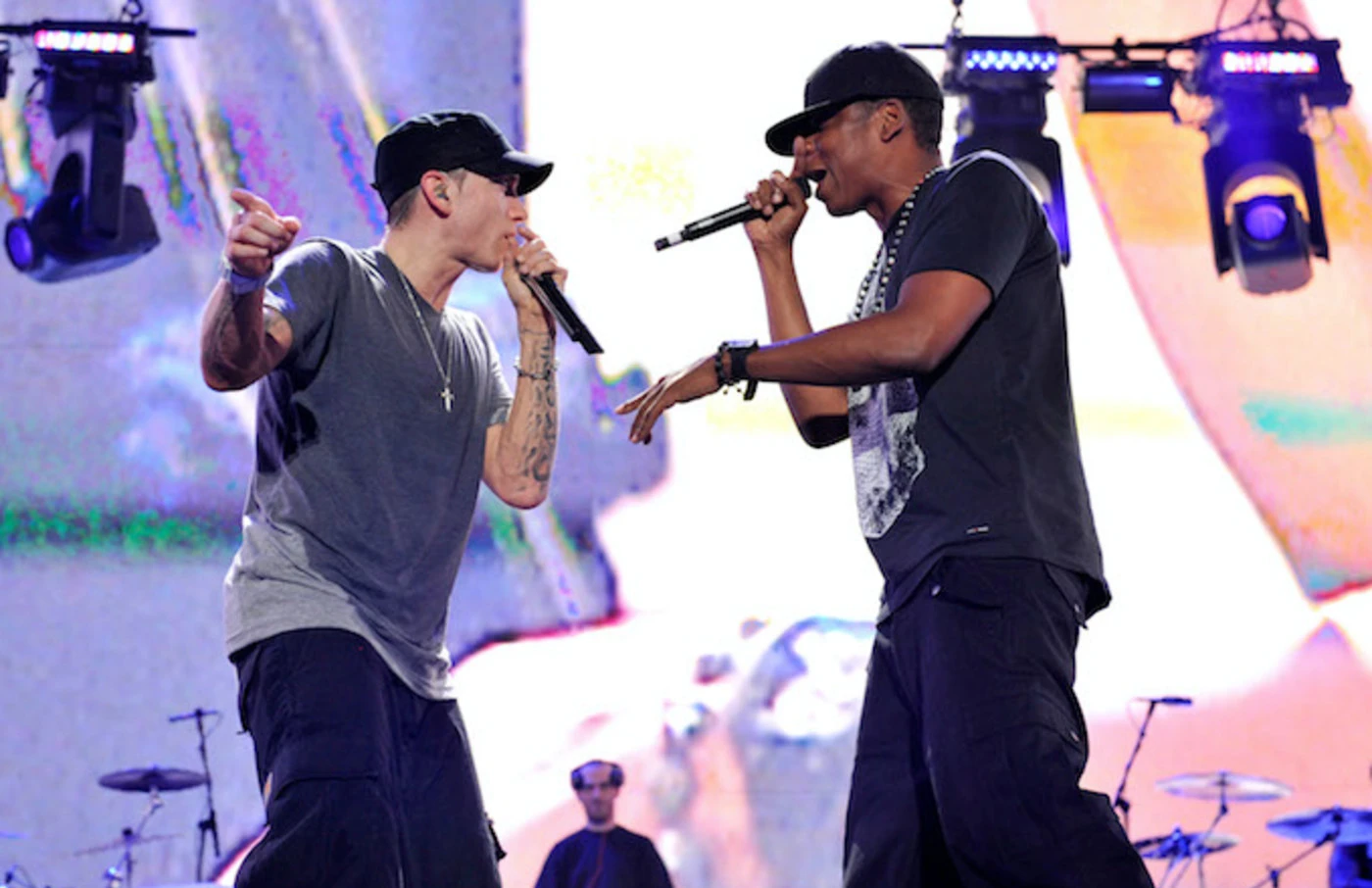 Eminem and Jay-Z performing on stage.