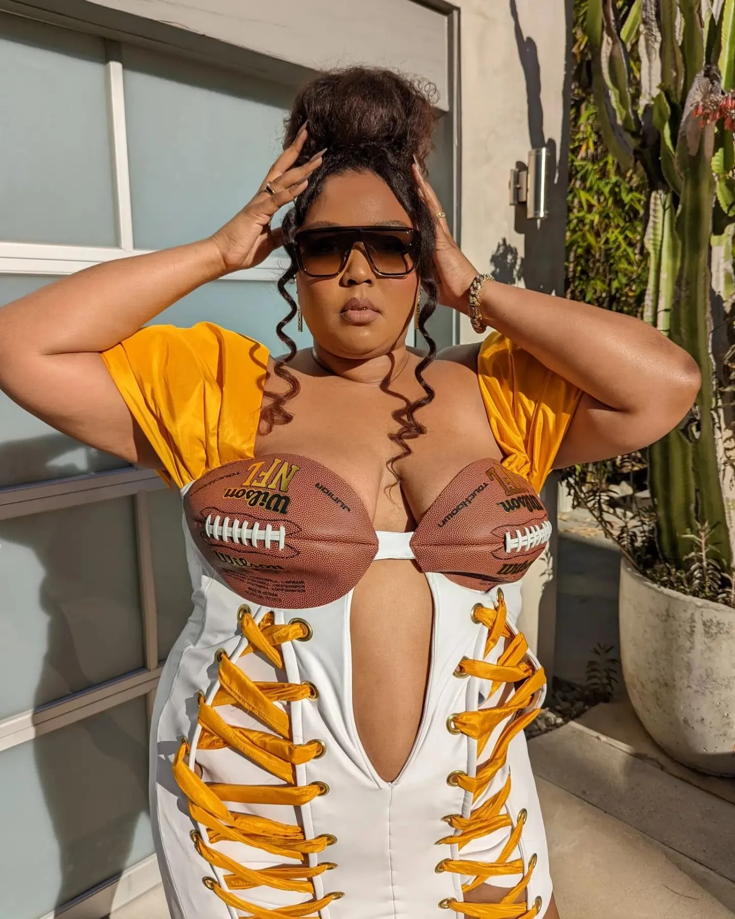 Lizzo in a football-inspired outfit. 