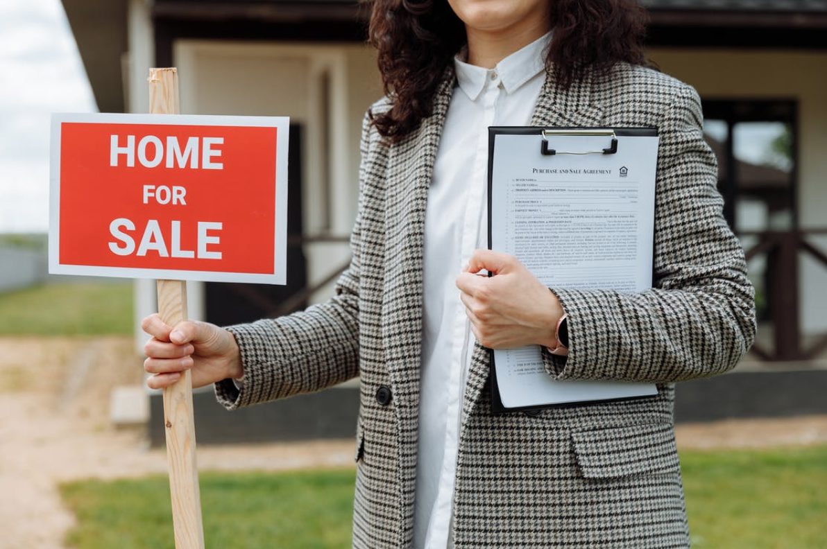 IMAGE SOURCE: https://www.pexels.com/photo/close-up-of-a-woman-holding-a-home-for-sale-sign-8469937/