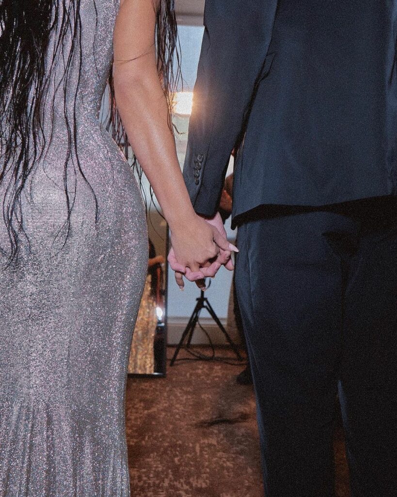 Kim K holding hands with Pete D
