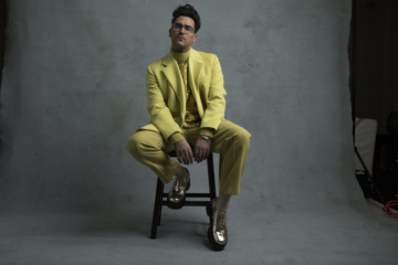 Dan Levy in lime green suit for Vogue