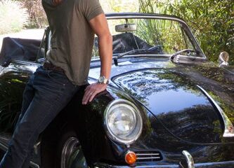 Mcdreamy, aka Patrick Dempsey, poses with his classic high end car