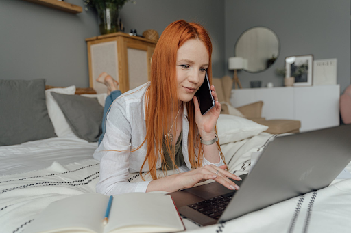 red head lady on the computer figuring out legal advice