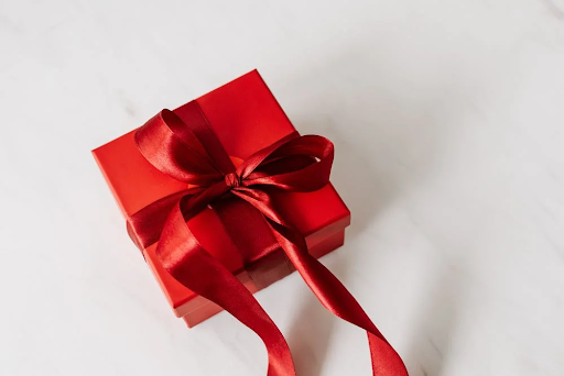a red christmas gift wrapped or holiday season and style