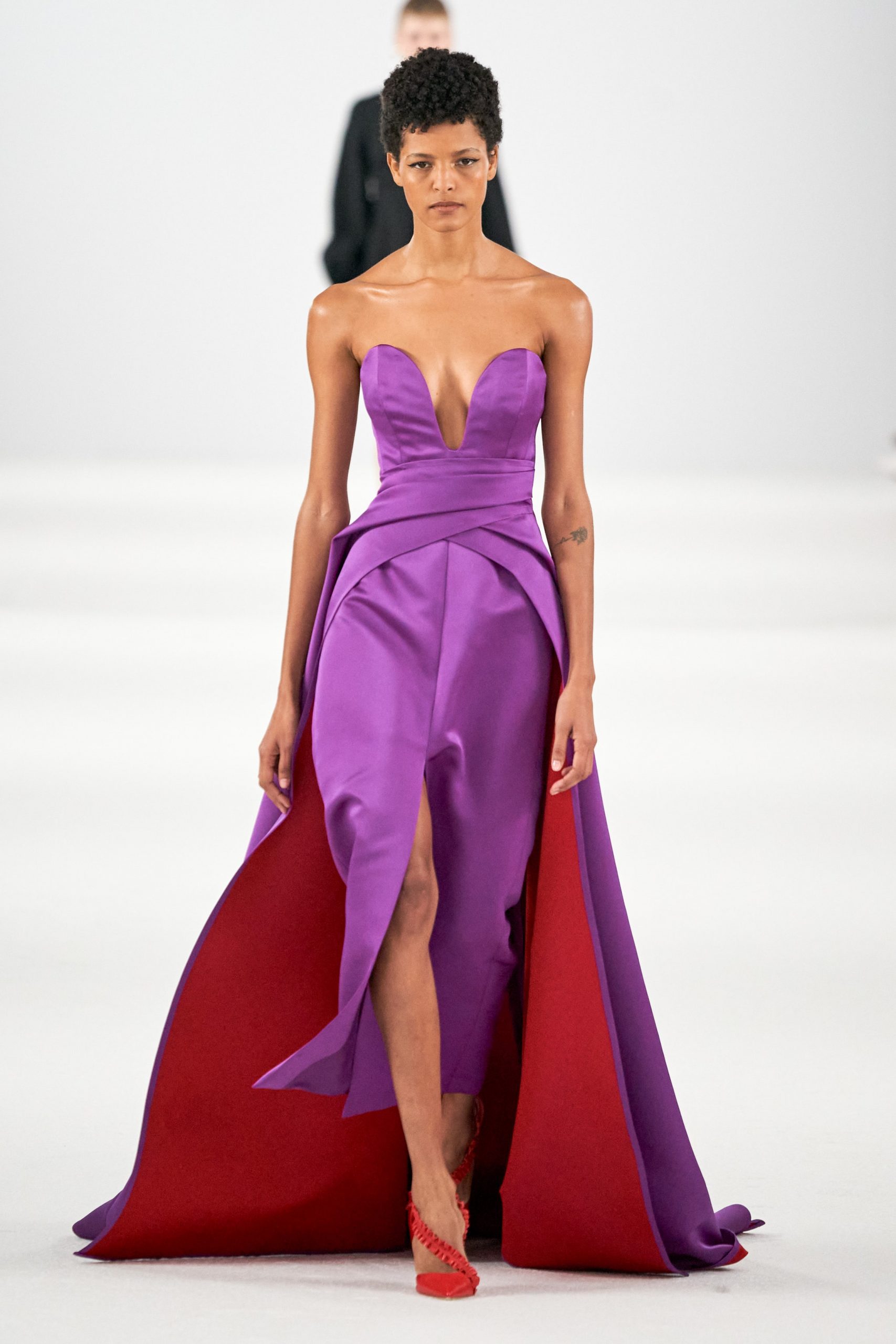 A model wears a piece from Carolina Herrera F/W 2022: a violet evening dress 