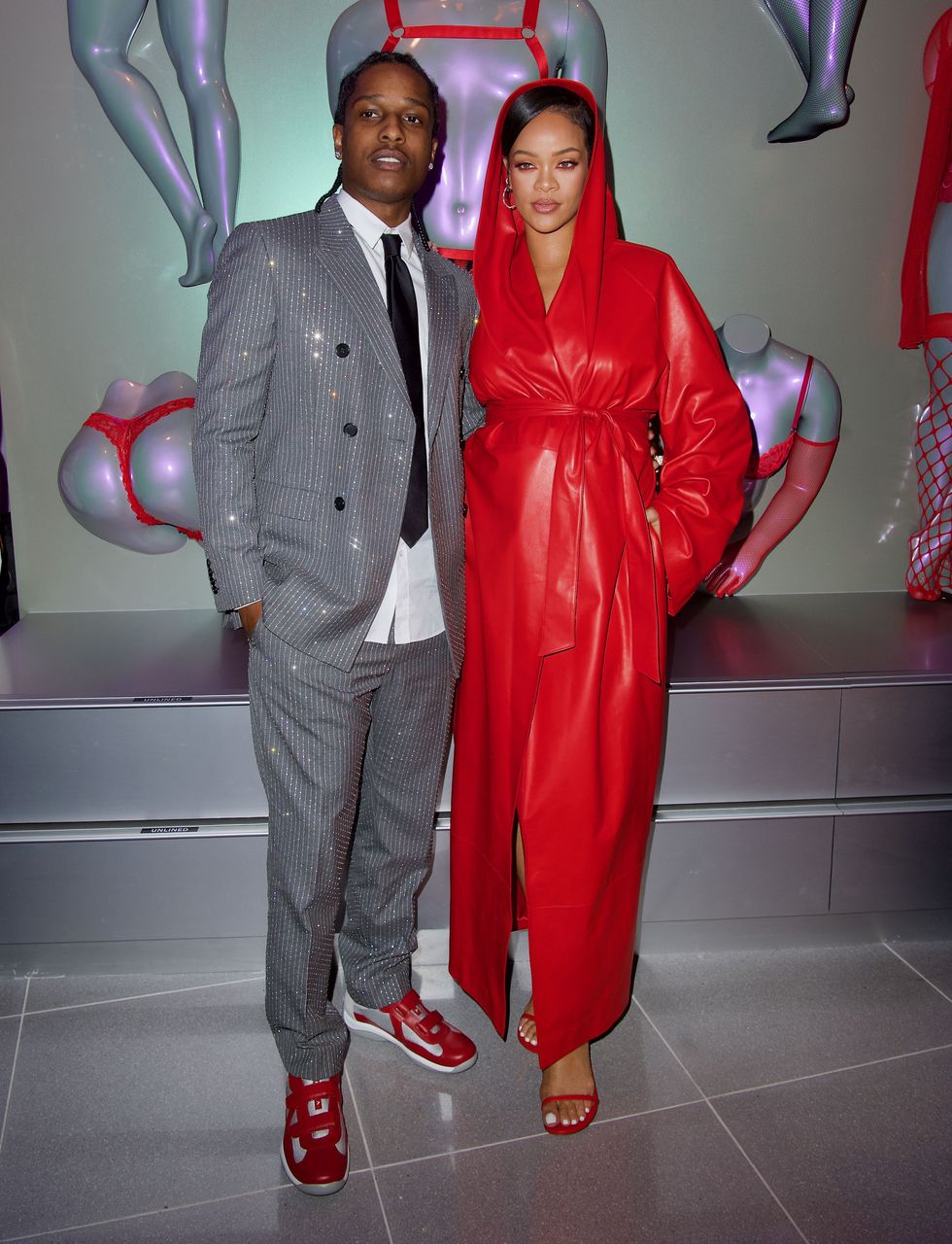 Rihanna in a red leather coat with A$AP Rocky