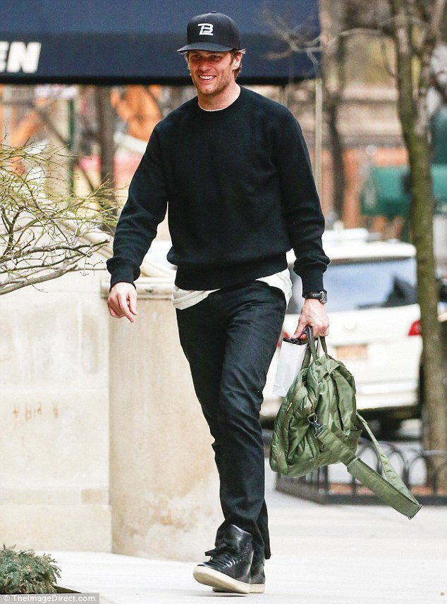 Tom Brady walking on the street.