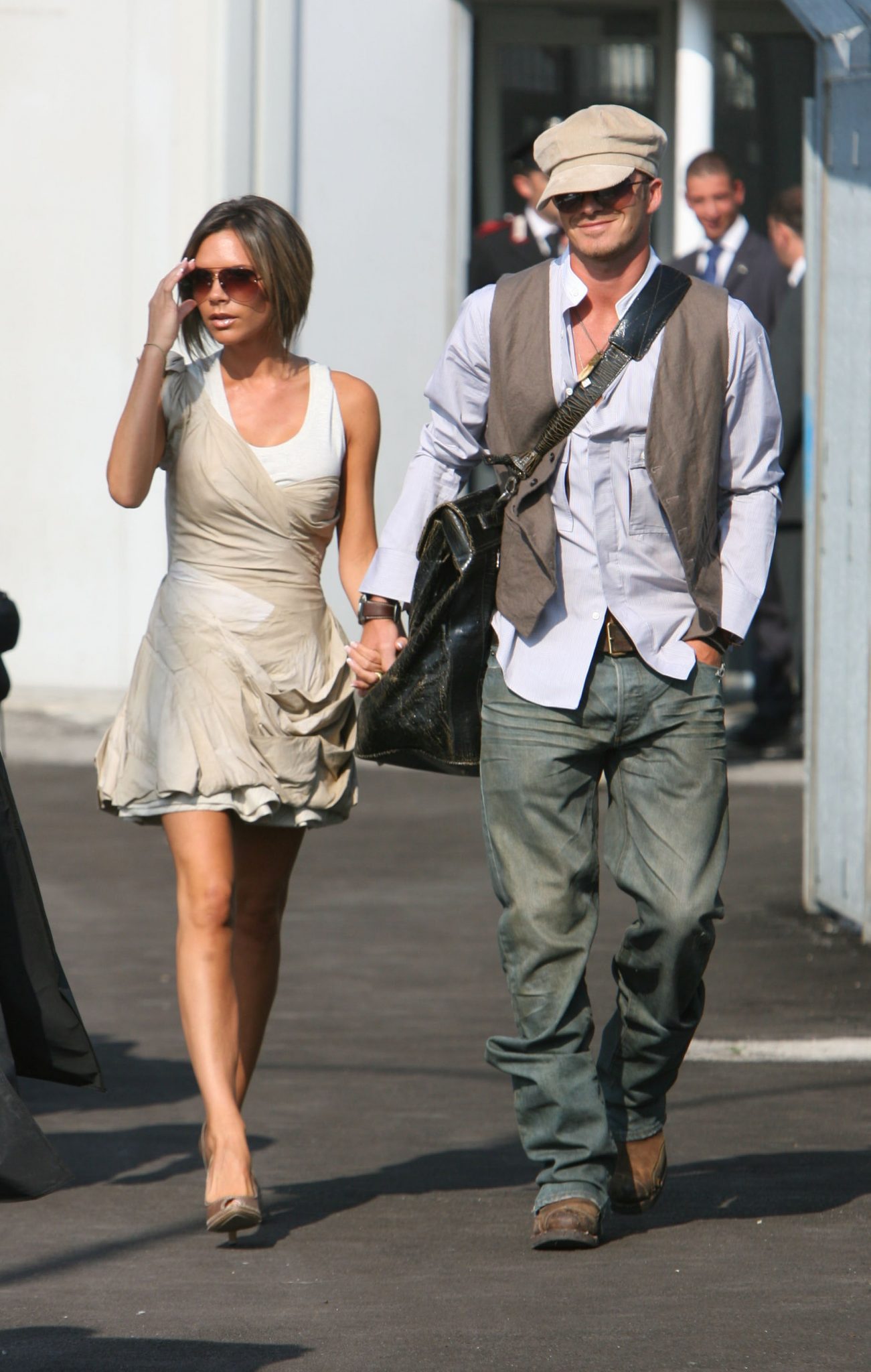 David Beckham walking on the street with Victoria Beckham
