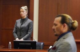 Actors Amber Heard and Johnny Depp watch as the jury leaves the courtroom at the end of the day at the Fairfax County Circuit Courthouse in Fairfax, Va., Monday, May 16, 2022. Depp sued his ex-wife Heard for libel in Fairfax County Circuit Court after she wrote an op-ed piece in The Washington Post in 2018 referring to herself as a "public figure representing domestic abuse."