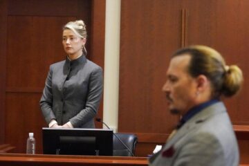 Actors Amber Heard and Johnny Depp watch as the jury leaves the courtroom at the end of the day at the Fairfax County Circuit Courthouse in Fairfax, Va., Monday, May 16, 2022. Depp sued his ex-wife Heard for libel in Fairfax County Circuit Court after she wrote an op-ed piece in The Washington Post in 2018 referring to herself as a "public figure representing domestic abuse."