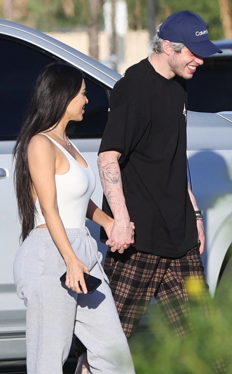 Kim and Pete holding hands.