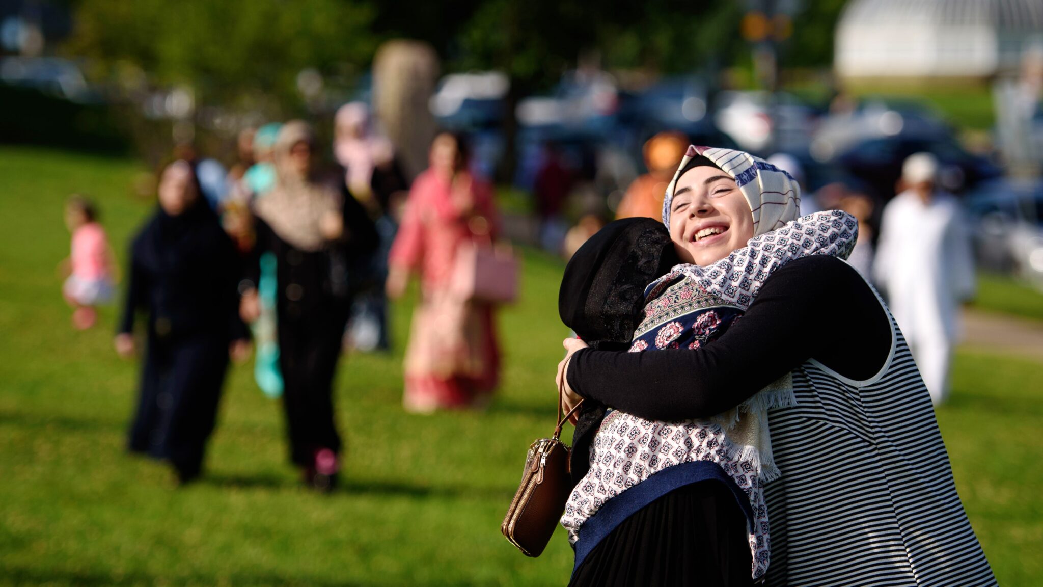 Muslims wishing each other Eid. 