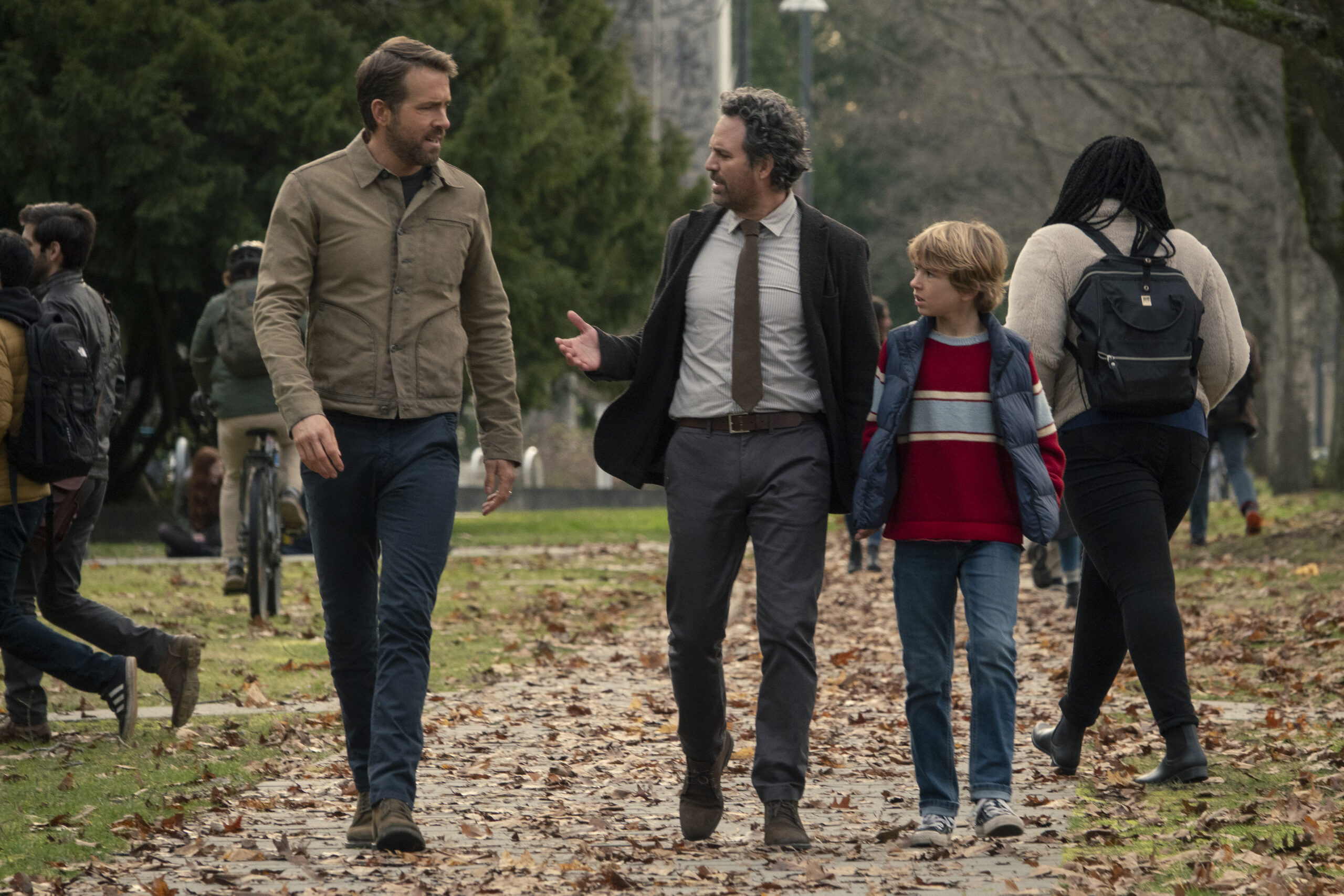 The Adam Project (L to R) Ryan Reynolds as Big Adam, Mark Ruffalo as Louis Reed and Walker Scobell as Young Adam. 