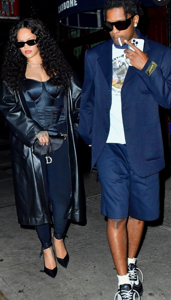 Rihanna wearing blue satin Gaultier cone bra on a night out with ASAP Rocky