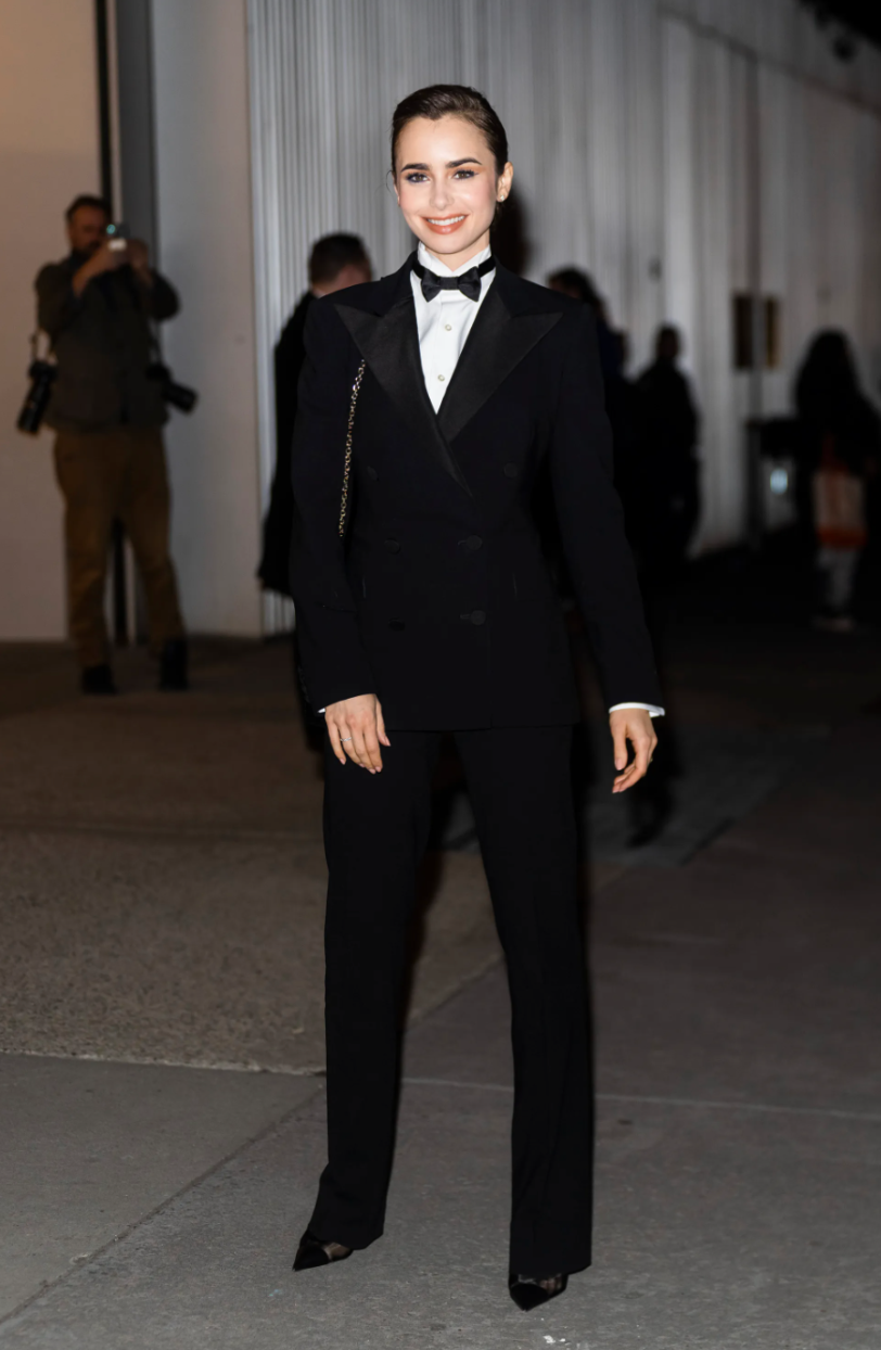 Lily Collins wearing a tuxedo to Ralph Lauren's Fall 2022 show in New York City.