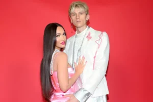 Megan Fox in pink dress with Machine Gun Kelly in white and pink tuxedo