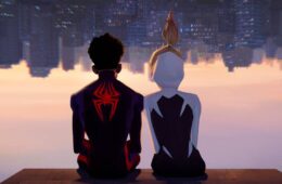 Miles Morales and Spider-Gwen(Stacy) sitting upside down, in their super suits, overlooking NYC