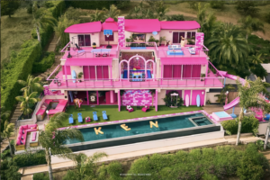Barbie's Malibu Dream house. Fuchsia, 3 stories, with an outdoor pool.