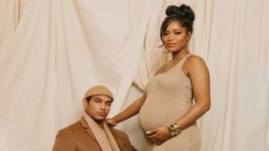 Keke Palmer and Darius Jackson posing for their maternity shoot themed in neutral colors.