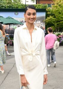 Neelam Gill posing at Wimbledon 2023 in white.