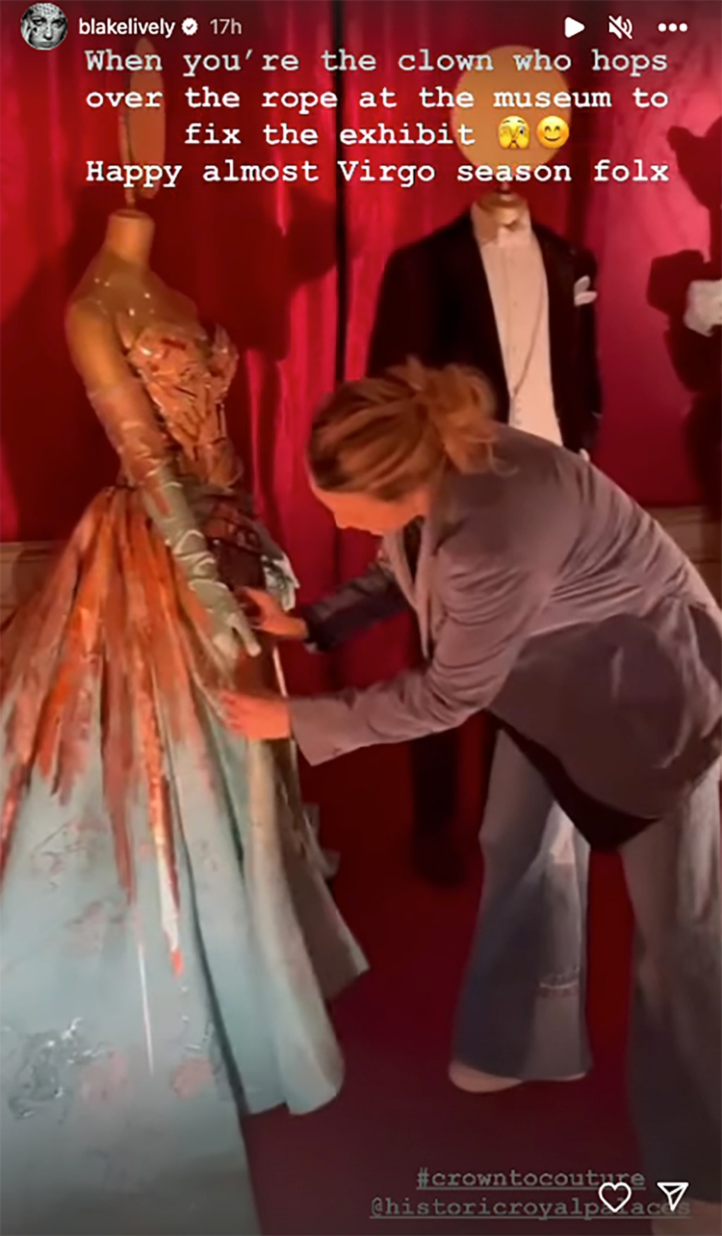 Blake Lively fixing her 2022 met gala gown at the 'Crown to Couture' exhibit at the Kensington Palace museum in London