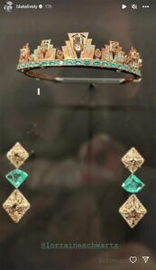 A up-close photo of the crown and earrings from Blake Lively's look at the 2022 met gala on display (encased in glass) at the Kensington Palace museum.