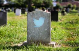 A picture of a tombstone with the Twitter logo on it.