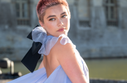 Florence Pugh at the Valentino Couture fashion show in a sheer blue gown or buzzed pink hair.