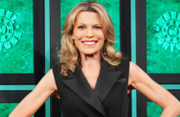 Vanna White posing in front of puzzle board on 'Celebrity Wheel of Fortune'