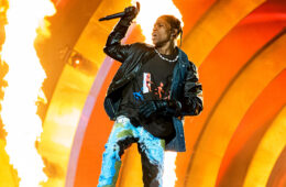 A close up of Travis Scott performing in Houston, TX at the AstroWorld Festival.