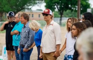 Matthew and Camila McConaughey holding hands with the victim's loved ones at Robb Elementary School (the site of the Uvalde mass shooting)