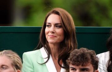 Princess Kate sitting in the crowd at Wimbledon 2023. She's Wearing a mint blazer with white lining.
