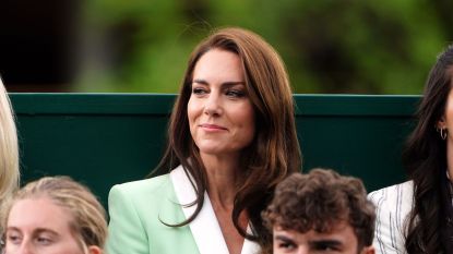 Princess Kate sitting in the crowd at Wimbledon 2023. She's Wearing a mint blazer with white lining.