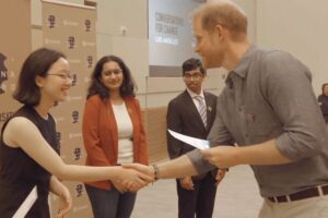 Prince Harry at a Conversation for Change meeting of the Diana Award. He is seen shaking hands with young activists in Los Angeles.