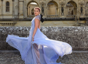 Florence Pugh twirling in a sheer blue gown and buzzed pink hair at the Valentino couture show