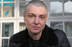 A portrait photo of Sinéad O'Connor at 56