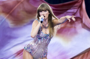 Taylor Swift performing the opening act of 'The Eras Tour' in a sequined and bedazzled bodysuit
