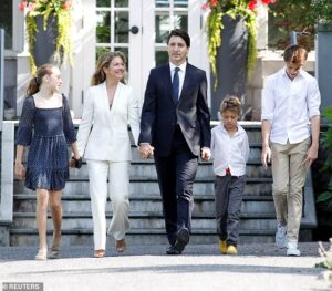 Justin and Sophie Trudeau walking hand-in-hand with their children surrounding them. From left to right: Ella-Grace, Sophie Trudeau, Justin Trudeau, Hadrien and Xavier.