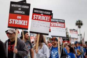 Supporters of the Writer’s Guild of America strike picket at Radford Studios Center in Studio City on Tuesday