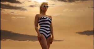Margot Robbie as the first 'Barbie' standing over a desert as a reference to 2001 Space Odyssey
