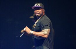 50 Cent performing at a concert where he assaulted a fan with his microphone.