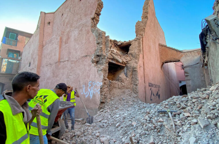 A photo of officers searching rubble for people injured in the Morocco Earthquake