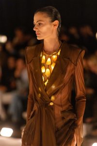 Schiaparelli model wearing a glowing multi-teardrop necklace for the SS26 runway show 