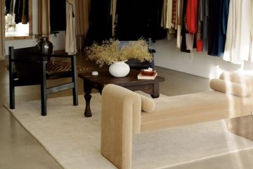 image of vintage store with clothing racks and a seating area