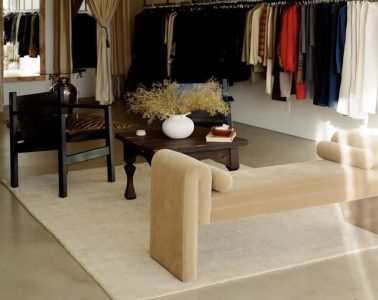 image of vintage store with clothing racks and a seating area