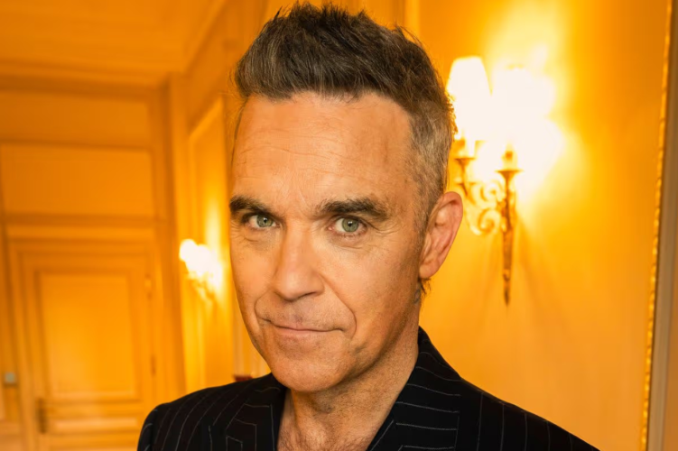 Robbie Williams breaks Beatles’ UK No. 1 albums record –